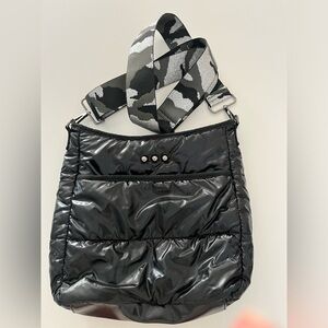 Black quilted crossbody with metallic adjustable strap